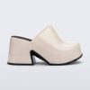 Side view of a beige Mia Platform Mule Heel with black sole