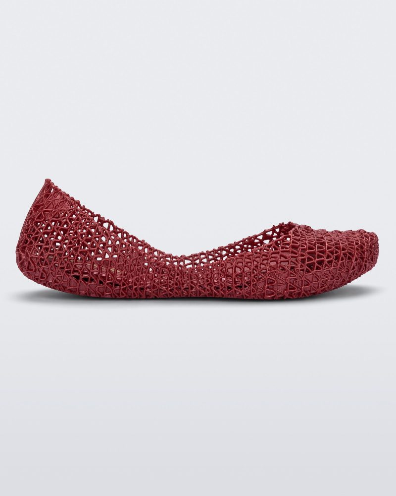 Side view of a metallic red Campana kids ballerina flat