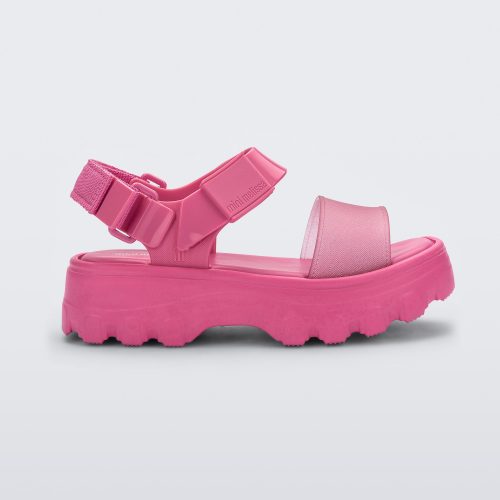 Side view of a Mini Melissa Kick Off platform sandal in pink with adjustable velcro ankle strap.