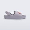 Side view of a grey Free Cute baby sandal with hippo face on front upper