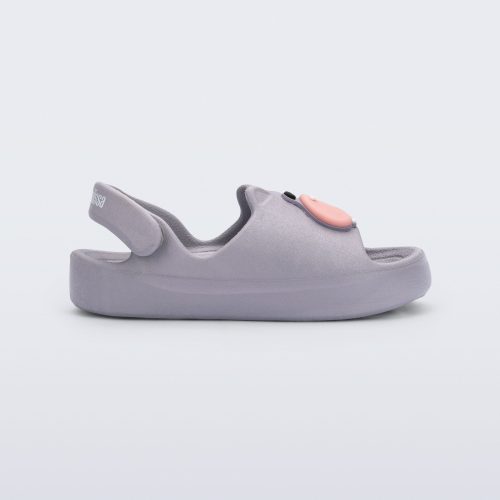 Side view of a grey Free Cute baby sandal with hippo face on front upper 