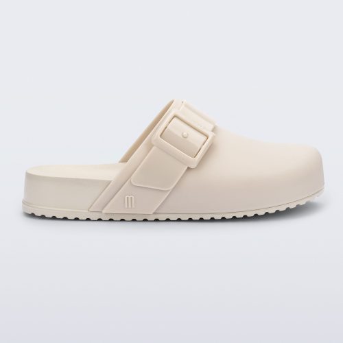 Side view of an adult beige Cozy Clog.