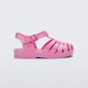 Side view of a pink Mini Melissa Possession sandal with a fisherman sandal design