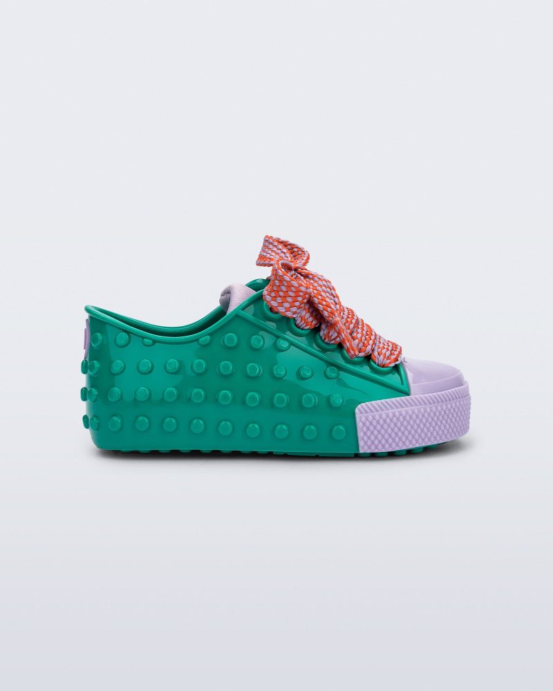 Side view of an green and purple Polibolha baby sneaker with multicolor laces.