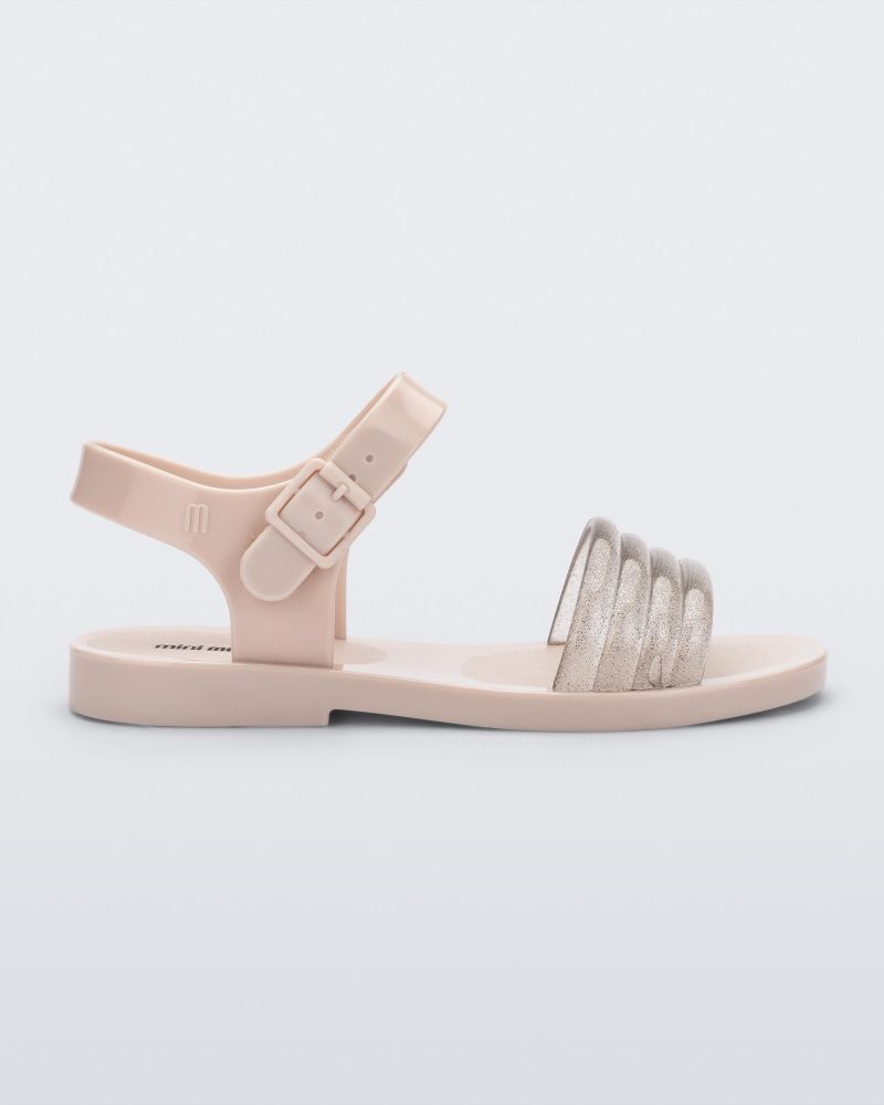 Side view of a beige Mar Wave kids sandal.