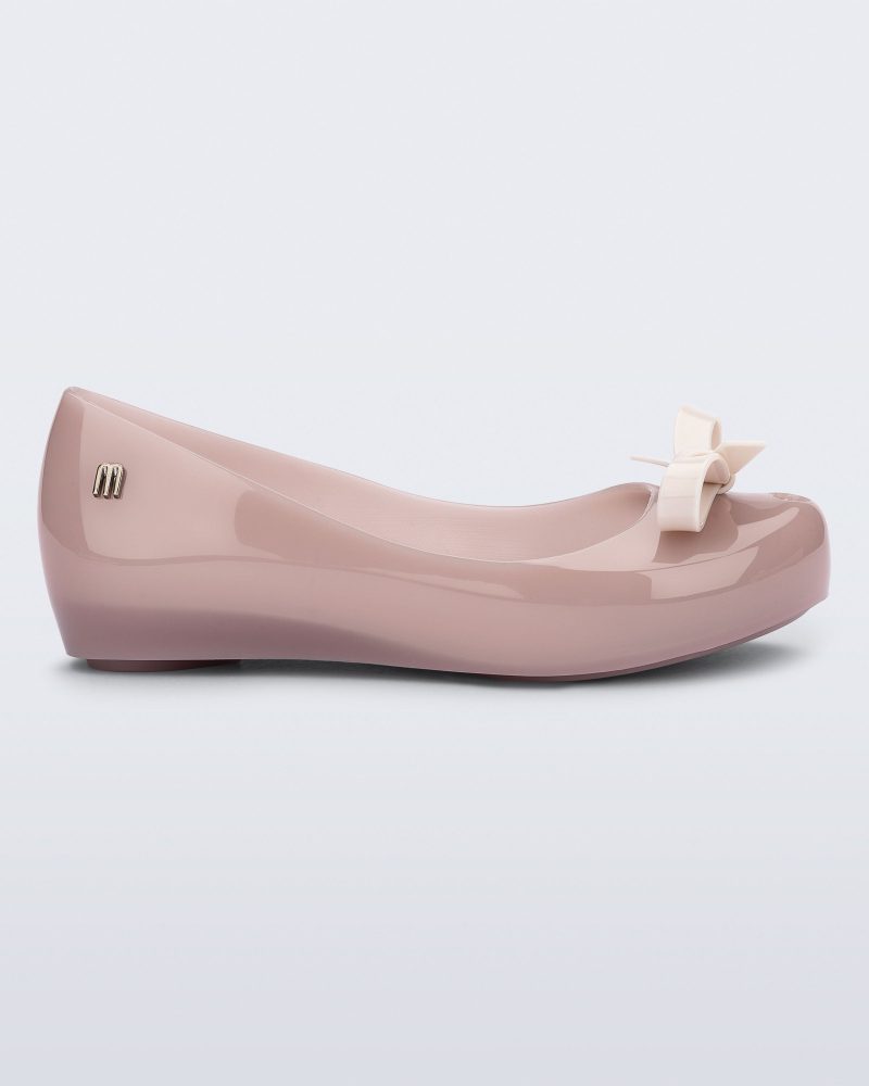 Side view of a pink kids Ultragirl Bow flat