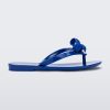 Side view of a blue Harmonic M Lover kids flip flop with Melissa logo on bow