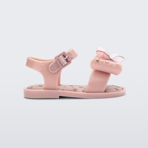 Side view of the Mini Melissa Mar Sandal with star print for baby in pink with butterfly bow applique and velcro closure on ankle strap.