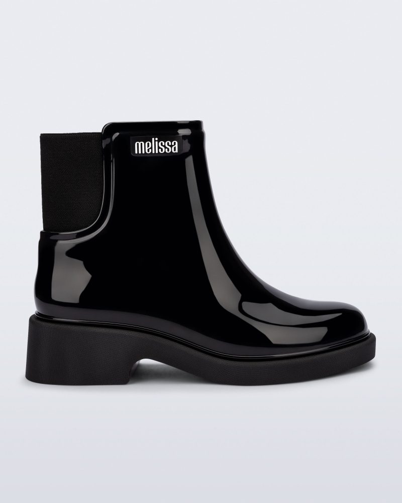 Side view of a black Chelsea Boot