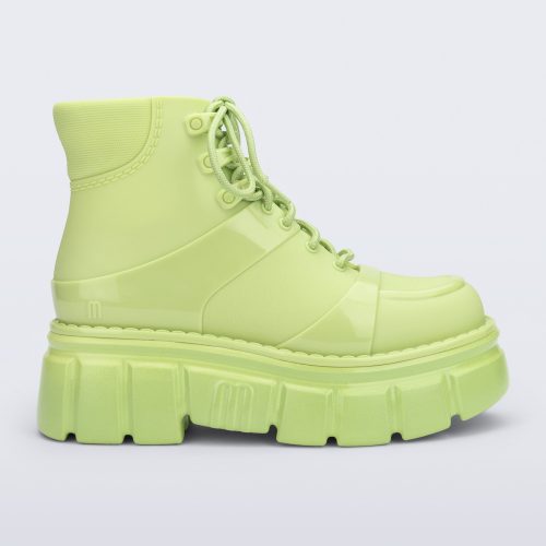 Side view of a green Rebel boot with laces