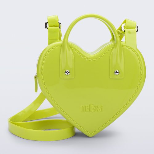 Front view of a green Heartbeat bag with small handles and longer strap.