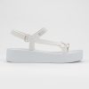 Side view of a white Sun Downtown Platform sandal.