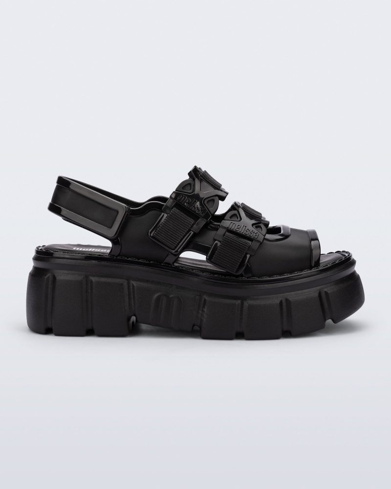 Side view of a black Rebel platform Sandal with back strap