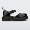 Side view of a black Ellie ankle strap loafer