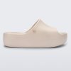 Side view of the beige Free Platform women's slide