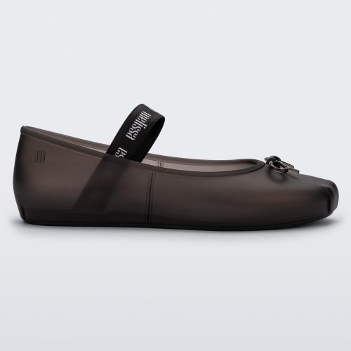 Side view of a Melissa Sophie ballet flat in black with M-logo strap and bow applique