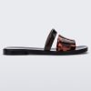 Side view of a black and tortoise Ivy women's slide