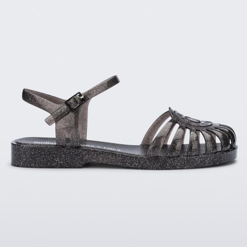 Side view of a glitter black Sandal + Bimba y Lola with ankle strap