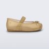 Side view of a pearly beige Sophie baby ballerina flat with bow