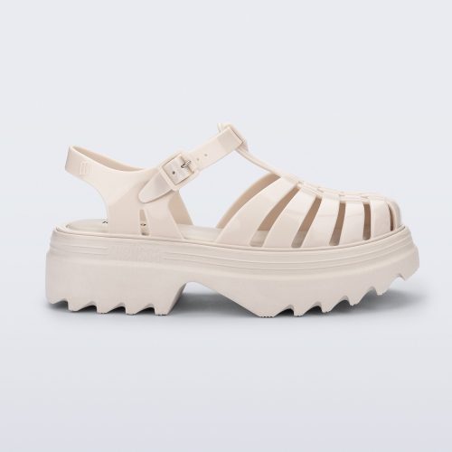 Side view of a beige Possession Platform II sandal.