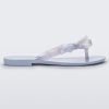 Side view of a Lilac/Pearly blue Melissa Harmonic Sweet flip flop with a lilac/pearly blue sole, straps and bow on top.