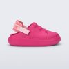 Side view of a pink with back strap Charlie baby sneaker