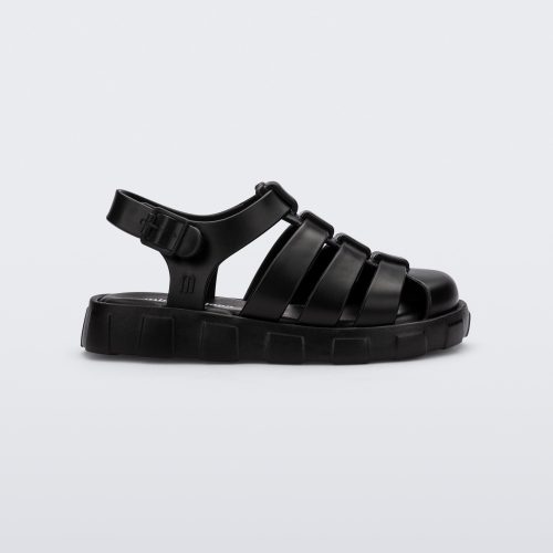 Side view of a black Megan baby sandal.