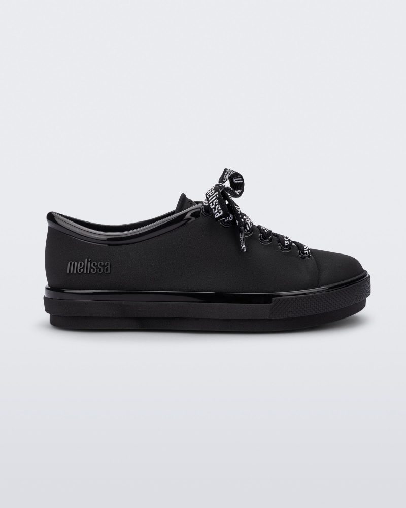 Side view of a black Hip M Lover kids sneaker with laces.