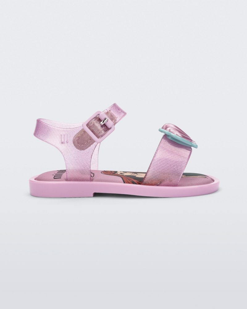 Side view of a glitter pink Mini Melissa Mar Sandal Princess sandal with a seashell detail on the front strap, an ankle strap and Princess Ariel soul