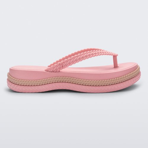 Side view of a pink/beige Melissa Leblon platform flip flop with details that mimic sisal braids on the sole and strap