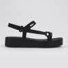 Side view of a black Sun Downtown Platform sandal.