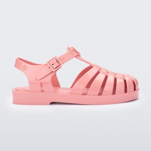 Side view of a light pink kids Possession sandal