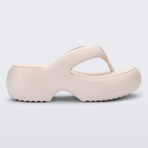 Side view of a beige Free Platform II flip flop