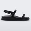 Side view of a black Melissa Soft Wave Sandal with a front and ankle strap.