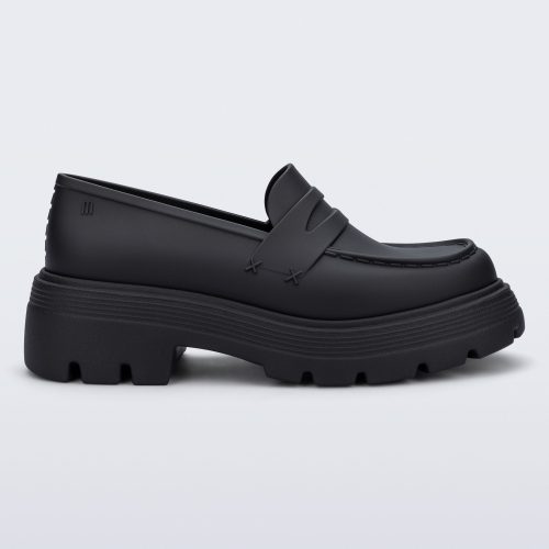 Side view of a matte black Royal adult loafer