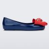 Side view of a blue Sweet Love Snow White kids flat with a red bow with red apple center