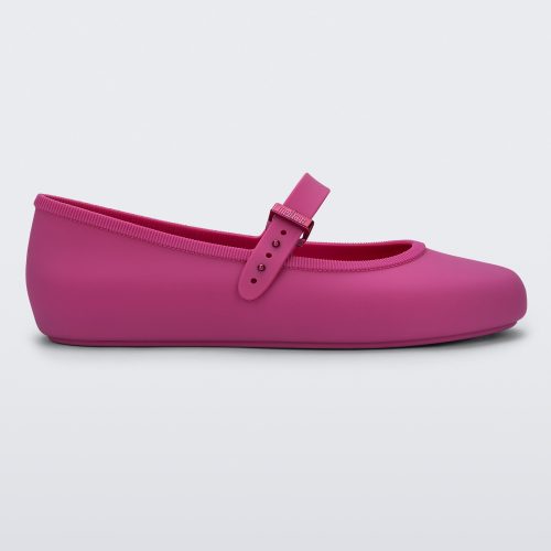 Side view of a pink Soft adult flat with strap and pink buckle