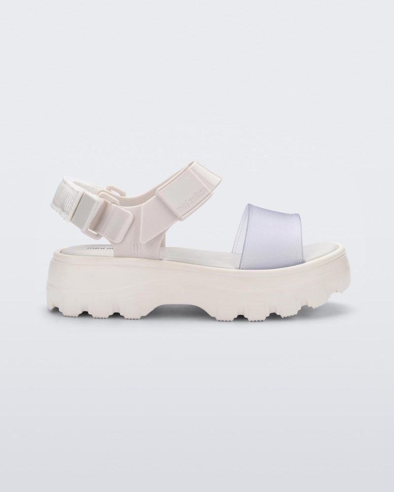 Side view of a Mini Melissa Kick Off platform sandal in white with adjustable velcro ankle strap.