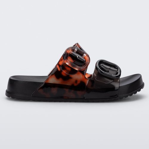 Side view of a black tortoiseshell Mini Melissa Cozy slide with two front straps with buckle details