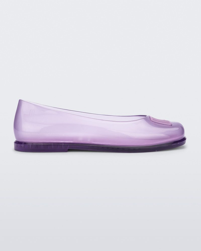 Side view of a lilac Ruby + Marc Jacobs flat