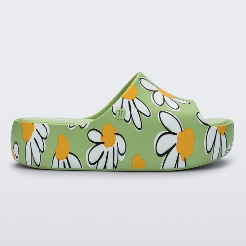 Side view of a green Free Print Platform slide with a white and yellow flower print.