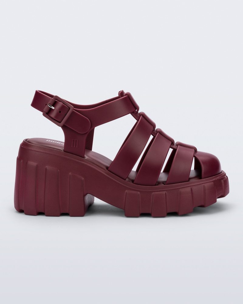 Side view of a red Megan platform fisherman style adult sandal