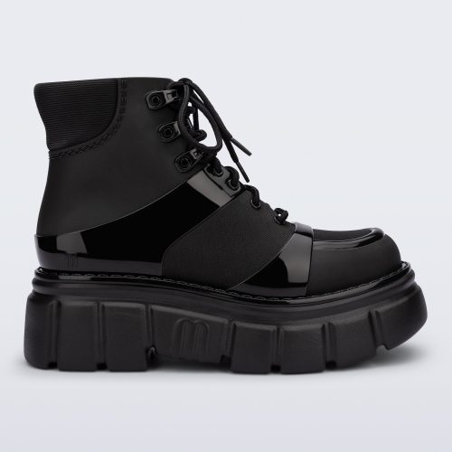 Side view of a black Rebel boot with laces