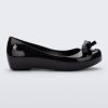 Side view of a Black Mini Melissa Ultragirl Bow flat with a black base and bow.