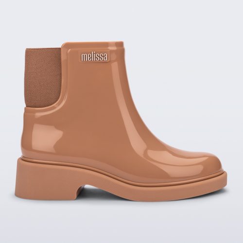 Side view of a brown Chelsea Boot