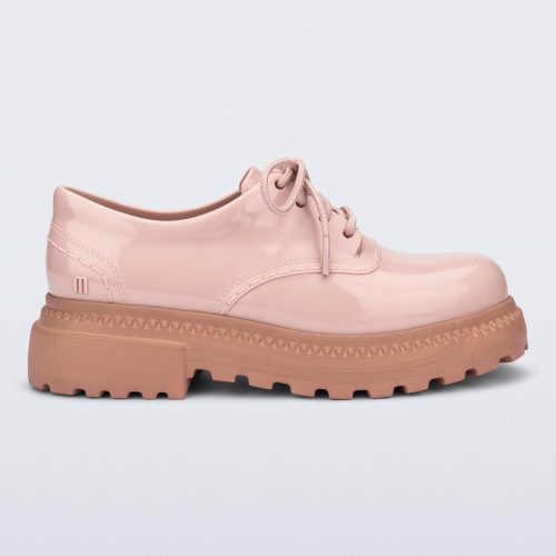 Side view of a pink with brown sole Charlotte adult sneaker loafer with laces