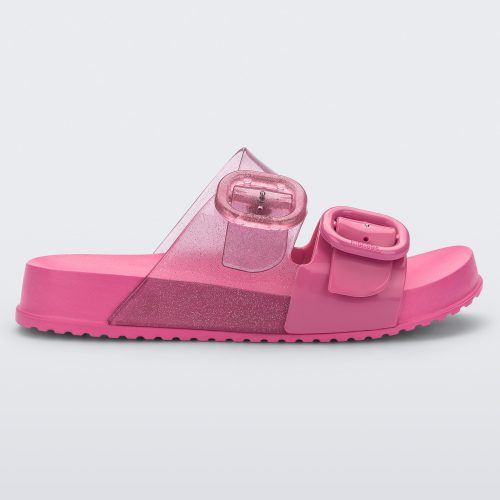 Side view of a pink Mini Melissa Cozy slide with two front straps with buckle details