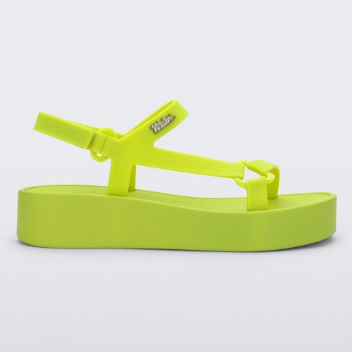 Side view of a green Sun Downtown Platform sandal.