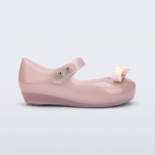 Side view of a pink baby Ultragirl Bow flat