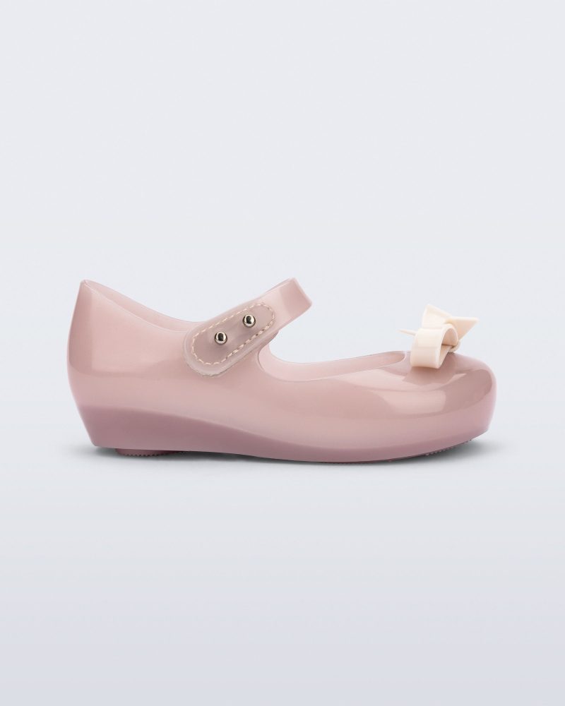 Side view of a pink baby Ultragirl Bow flat